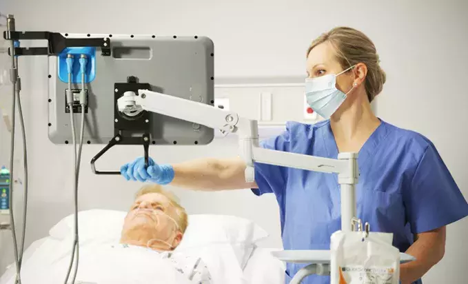 GlideScope Core station articulating over patient